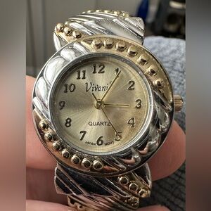 Women’s Vivani quartz (spring loaded band) watch.